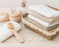 https://kcnmoon.com/cdn/shop/articles/stacked-towels-brush-soap-cotton-swab-cosmetic-bottle-wooden-background_100x80_crop_center@2x.jpg?v=1652381969